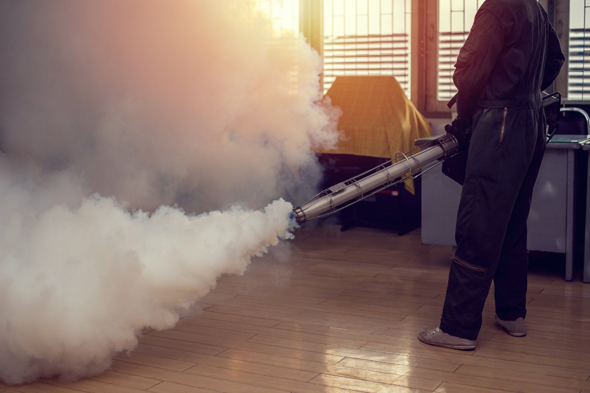 Technician fogging the interior of a property